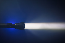 Ray Of Pocket Flashlight In Smoke, Copy-space Background