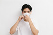 © Gengwit - Young asian male wearing medical face mask to protect corona virus, studio portrait.