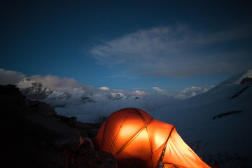 mera peak, mountains base camp with snow in chaurikharka night in tent