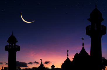 Wall Mural - silhouette of mosque in the night and crescent moon in ramadan month