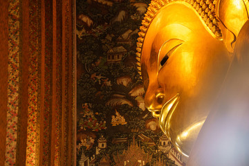 Golden head of the Buddha lying