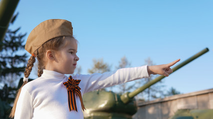 Little Girl at the Heroes Memorial. Russian Victory Day.  Second World War Victory.