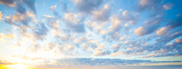 blue sky clouds background. beautiful landscape with clouds and orange sun on sky