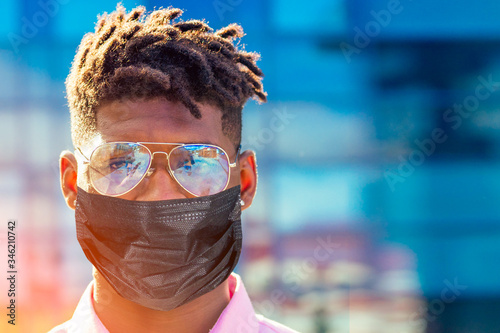 Fotomural portrait stylish and handsome African student American man with cool dreadlocks