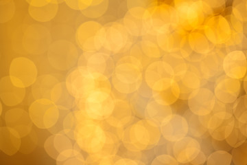 Beautiful golden bokeh light on gold background