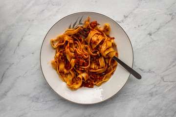 Wall Mural - Tagliatelle pasta with lentil bolognese. Vegetarian bolognese sauce. Top view. 