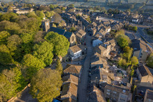 Aerial Shot Of Haworth Main Street, Near Keighley, West Yorkshire Home Of The Bronte Sisters, Featuring St Michael & All Angels Church, Where Maria Brontë, Patrick Brontë, Elizabeth Brontë, Are Buried