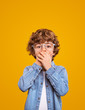 © kegfire - Shocked kid in glasses covering mouth