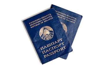 2 old rumpled passports of a citizen of the Republic of Belarus. Isolated on white