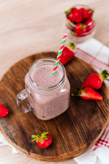 Wall Mural - Fresh strawberry milkshake in glass, smoothie with berries. and fresh strawberries. Healthy food and drink concept. Healthy food for breakfast and snack. copy space