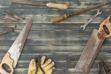 old tools on dark wooden background