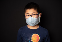 Portrait Of Asian Boy In Glasses Wearing Cloth Face Mask