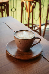 Wall Mural - A cup of coffee with latte art on top