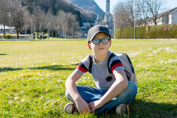 young boy with the basilica of Lourdes in France