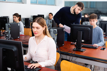 Wall Mural - Teacher conducts computer science exam in university class