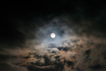 Wall Mural - the flower moon shining bright in the cloudy sky, 7/5/2020 , cornwall, uk