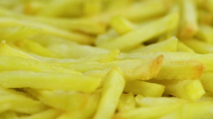 Wall Mural - Rotating plate with crispy French Fries (seamless loopable)