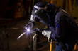 © niwat - Metal workers use manual labor. Skilled welder. Factory workers making OT. Welder is welding the steel in the factory. welder Industrial automotive part in factory.