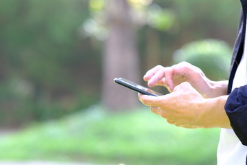 Poster - businessman using a smartphone and space for text