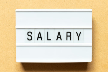 Poster - Lightbox with word salary on wood background