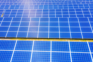 solar panels with the sunny sky. Blue solar panels. background of photovoltaic modules for renewable energy. Aerial view of Solar panels Photovoltaic systems industrial landscape