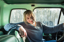 Portrait Of Smiling 14 Year Old Girl Behind The Wheel Of A 1970's Pick Up Truck