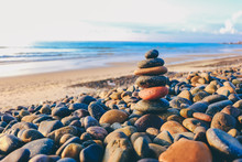 Close Up Of Rocks Stacked One On Top Of Another With Soft Selective Focus. Stones Are Naturally Balanced On The Background Of The Sea. High-quality Free Stock Images Of Rocks And Landscapes