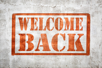 Canvas Print - welcome back graffiti sign on wall