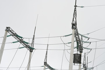 High voltage wires. City electrical substation, close-up, transformer with high-voltage wires.