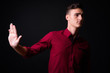 © Ranta Images - Portrait of young handsome businessman with stop gesture