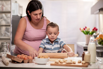 Poster - Mom and son have fun in the kitchen.