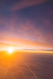 Fototapeta Zachód słońca - the sea of cloud sunset sky background from window airplane
