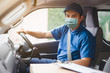 © Travel man - Young asian delivery man wearing protective face mask driving his van with packages on the front seat due to Coronavirus disease or COVID-19 outbreak situation in all of landmass in the world.