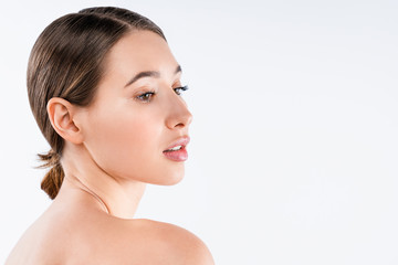 Wall Mural - Beautiful young woman with clean skin close up isolated on white background