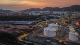 Fototapeta Przestrzenne - Gas and oil production sources that are turning on lights in order to wait for work to produce fuel or gas during  such as sunset