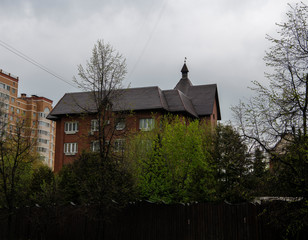 Wall Mural - urban high-rise buildings against a changing sky