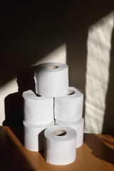 Stack of toilet paper, made with recycled paper. Selective focus.