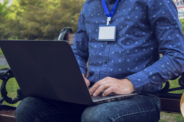 Person working a laptop in the park