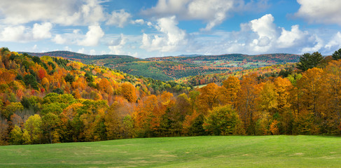 brilliant fall colors in vermont countryside road and farm in autumn near woodstock