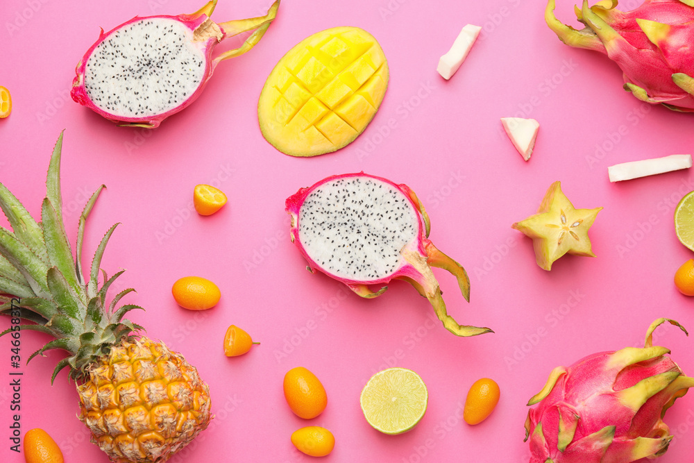Tasty exotic fruits on color background
