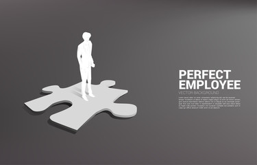 Poster - Silhouette of businessman standing on jigsaw piece. Concept of perfect recruitment. Human Resource. put the right man on the right job.