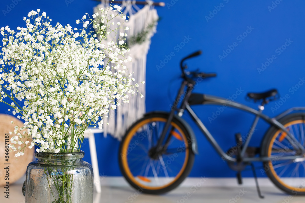 Vase with beautiful flowers in modern room
