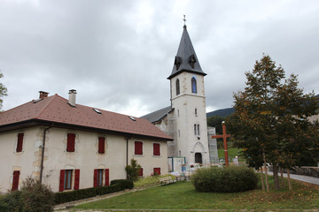 The Church of Our Lady of the Assumption in Balmont, Annecy, France. In the center of the hamlet of Balmont, the Notre-Dame de l'Assomption church rises its bell tower in the rural landscape.