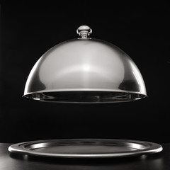 Tray and cloche on dark background