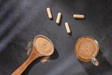 Poster - Lepidium meyenii - Maca root health drink in a glass with powdered