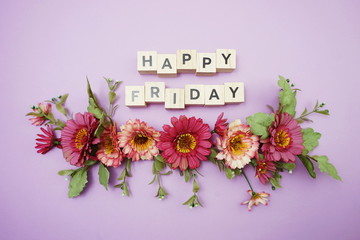 Wall Mural - happy friday alphabet letters with pink flower decoration on purple background