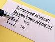 One person is answering quetion about compound  interest.