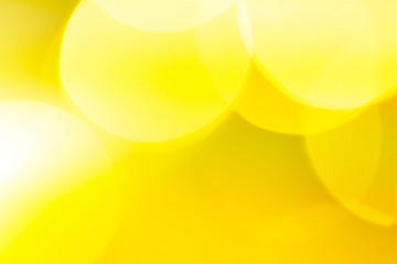 Summer yellow background with natural light bokeh. Abstract sun light, sunny vacation background.