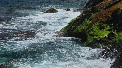 Wall Mural - Waves break about the rocky coast of the azure coast, splashes, clear water, azure water, famous place