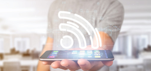Poster - businessman holding a wifi icon with data all around